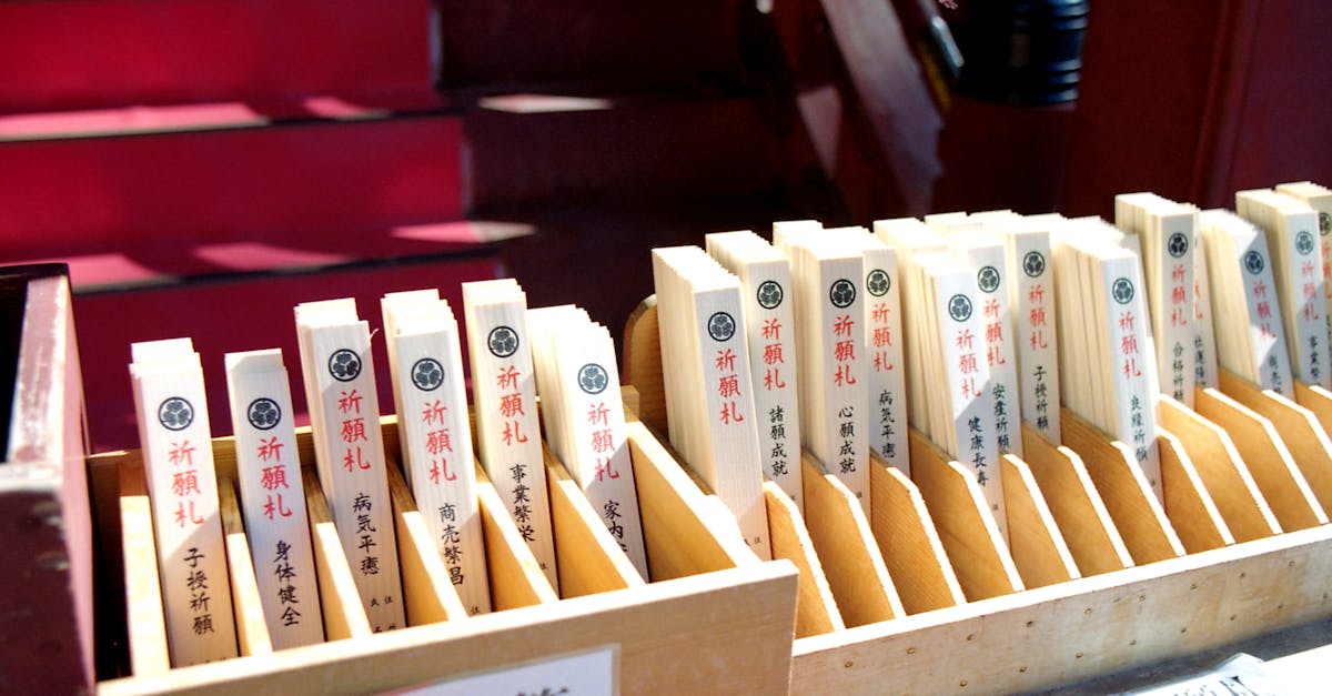 Close-up of traditional Japanese prayer sticks in Nikko temple setting.