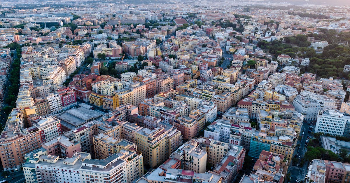 Stunning aerial perspective of a vibrant cityscape at dusk showcasing dense urban architecture.