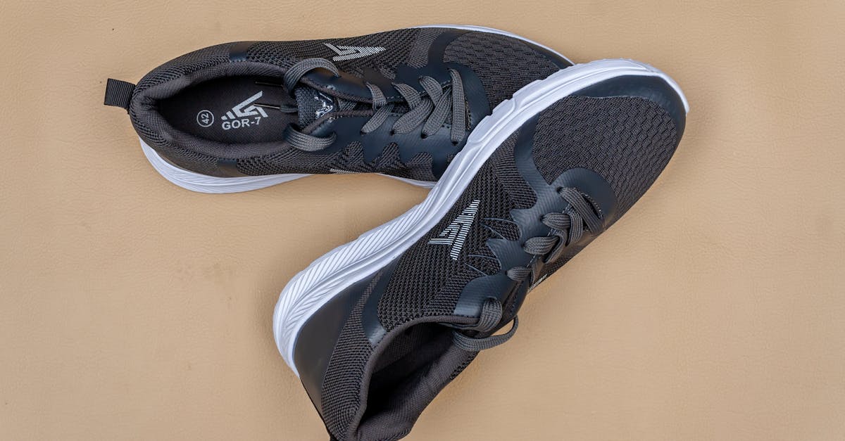Close-up of stylish black sneakers on a beige background with a modern design.