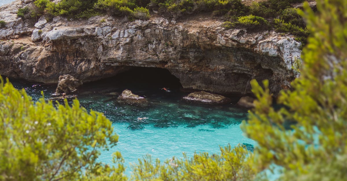 Discover the stunning turquoise waters and rocky cliffs of this serene sea cave location.