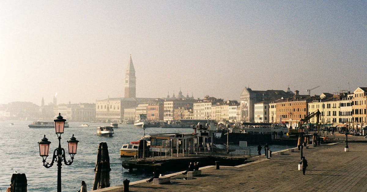 Beautiful view of Venice waterfront with historic buildings and a tranquil canal.