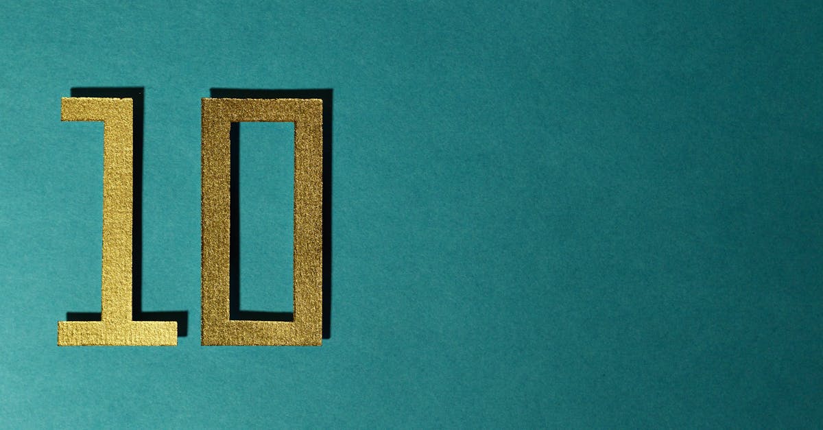 Stylish gold number ten on a textured teal background for design concepts.