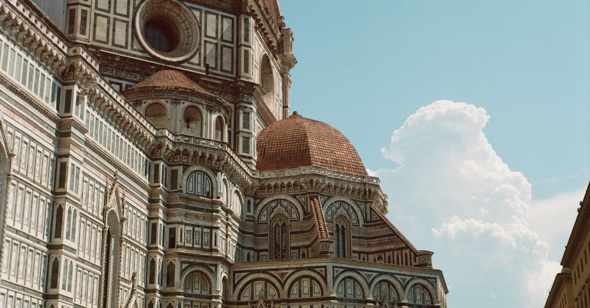 Stunning view of Florence Cathedral's intricate architecture beneath a clear blue sky.
