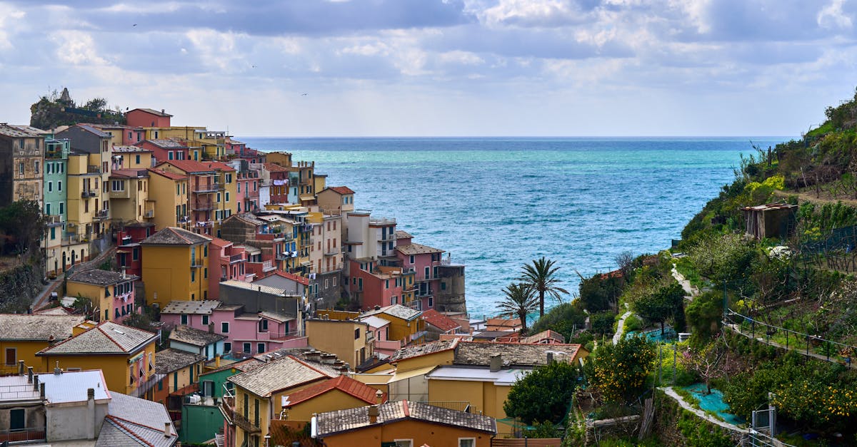 Scenic view of colorful buildings by the sea in a Mediterranean village.