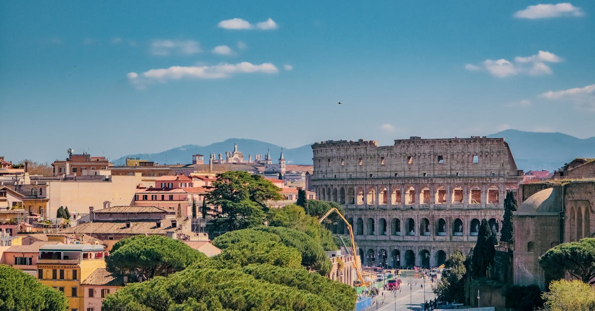 A breathtaking view of Rome featuring the iconic Colosseum on a sunny day.
