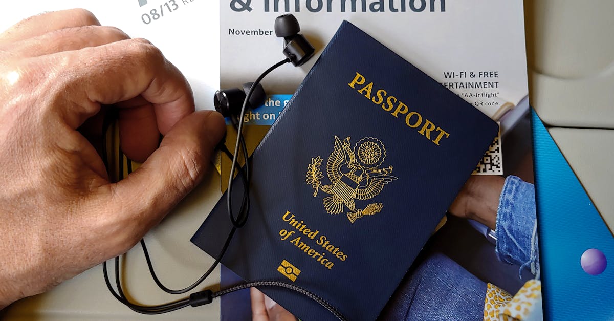Close-up of US passport with inflight magazine and headphones on an airplane seat, ready for travel.