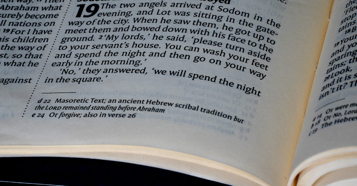 Detailed close-up of a page from the Bible's Book of Genesis, highlighting scripture text.