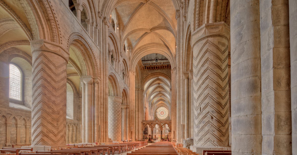 Explore the stunning Gothic architecture of Durham Cathedral's nave, a UNESCO World Heritage site in England.