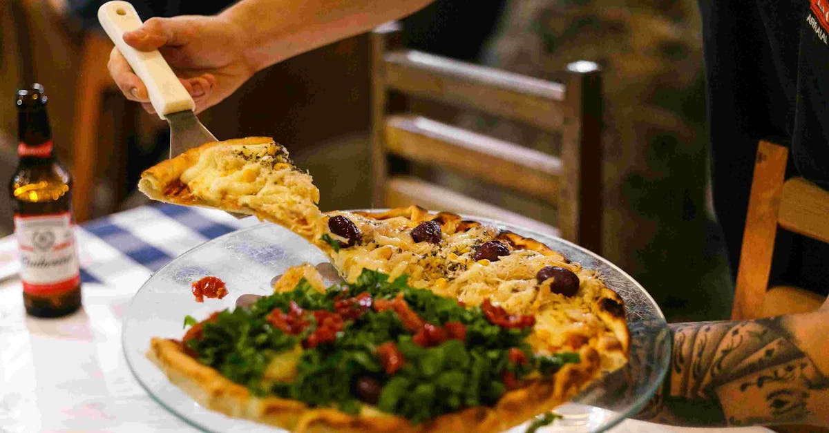 Delicious pizza served at a cozy dinner table with a refreshing drink on the side.