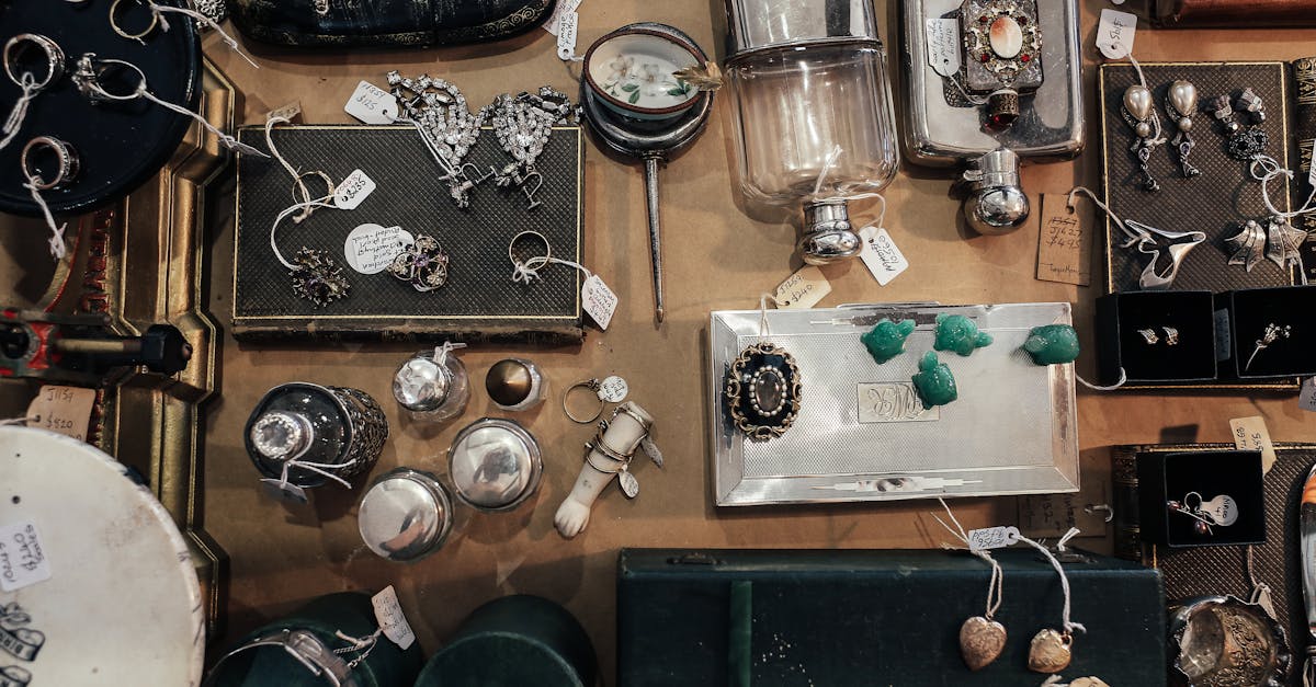 Aerial view of a vintage jewelry and antiques market display with various items for sale.