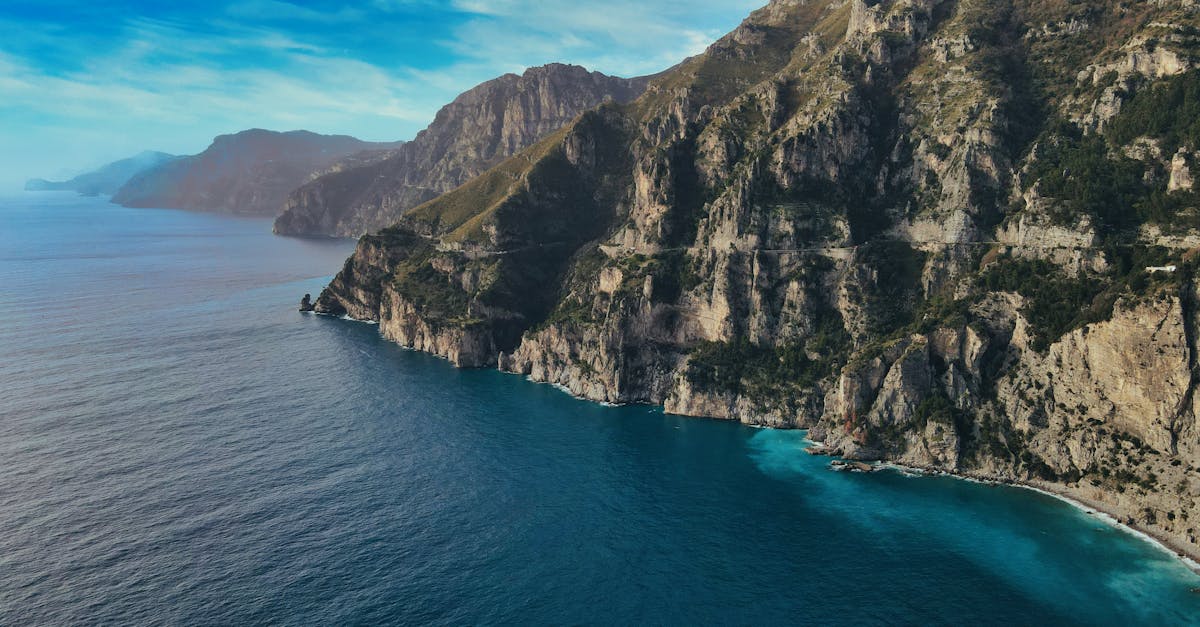 Stunning aerial view of Positano's rugged cliffs and deep blue sea on Italy's Amalfi Coast.