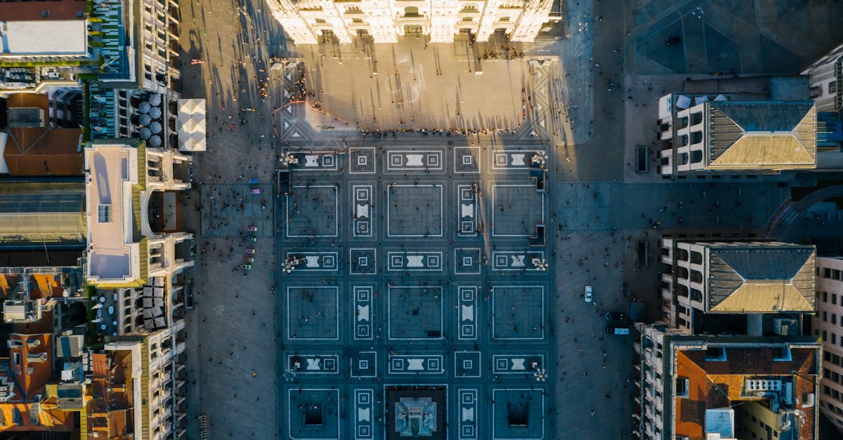 Stunning aerial photo of a classic European city square and towering cathedral.